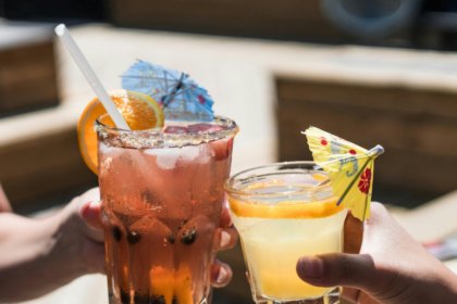 Two alcoholic drinks in glasses