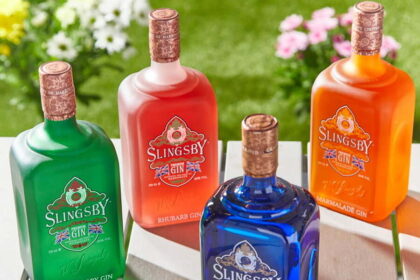 Four bottles of Slingsby Gin on a table in sunshine
