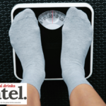 Looking down at feet on bathroom scales