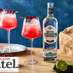 Bottle of Jose Cuervo blanco tequila with a cranberry spritz serve