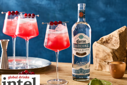 Bottle of Jose Cuervo blanco tequila with a cranberry spritz serve
