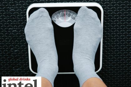 Looking down at feet on bathroom scales