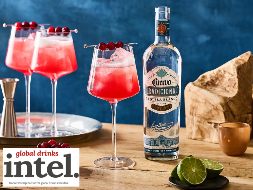 Bottle of Jose Cuervo blanco tequila with a cranberry spritz serve
