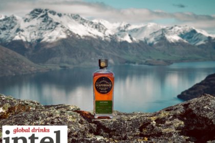 Scapegrace whisky bottle against lake and mountain backdrop