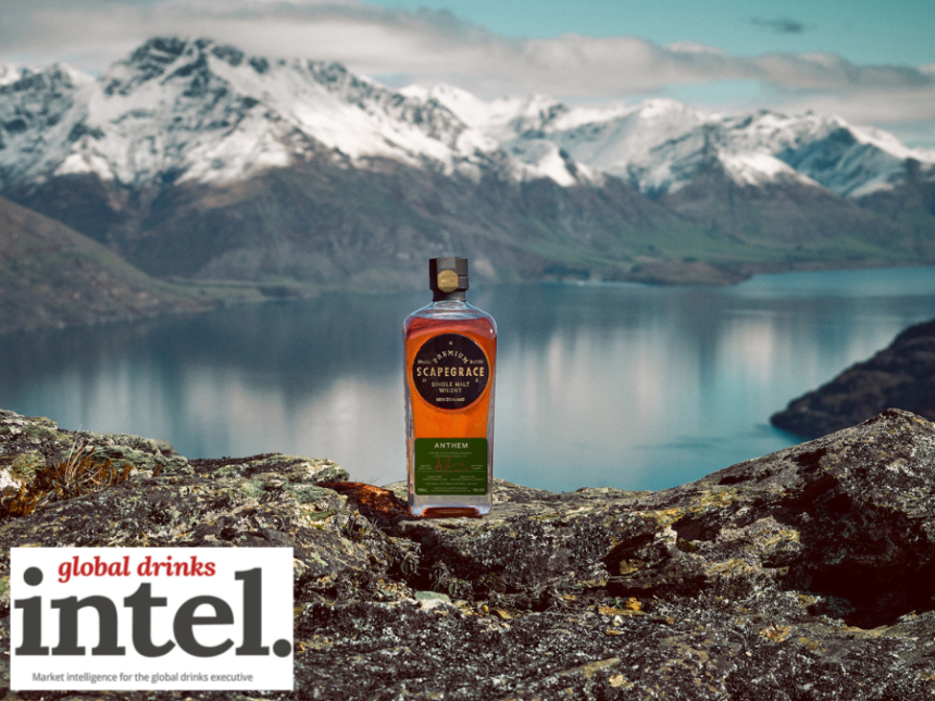 Scapegrace whisky bottle against lake and mountain backdrop