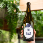 Bottle of Big Salt wine being held up