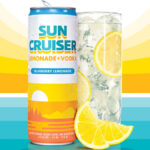 A can of Sun Cruiser next to a glass with sunset graphic in background