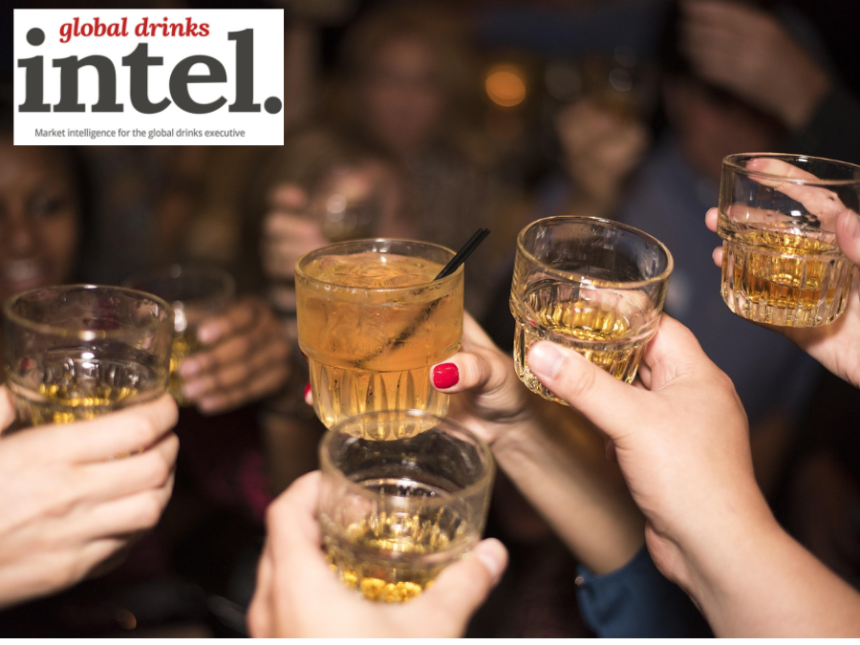Four raised glasses in a crowd