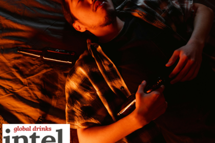 Drunk male consumer lying back with empty bottles