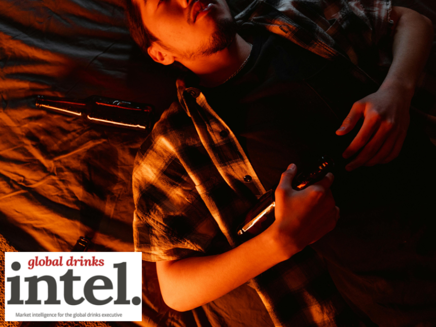 Drunk male consumer lying back with empty bottles