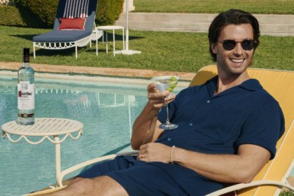 Patrick Schwarzenegger with bottle of Ketel One