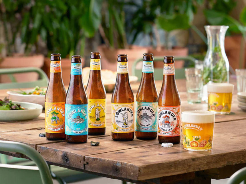 Bottles of Lowlander LoNo beers on a wooden table outside