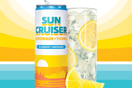 A can of Sun Cruiser next to a glass with sunset graphic in background