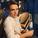 Robert Pattinson with 1664 bottle