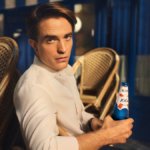 Robert Pattinson with 1664 bottle