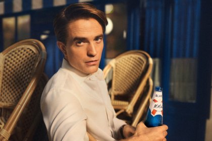 Robert Pattinson with 1664 bottle