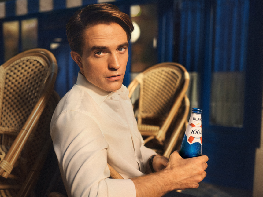 Robert Pattinson with 1664 bottle