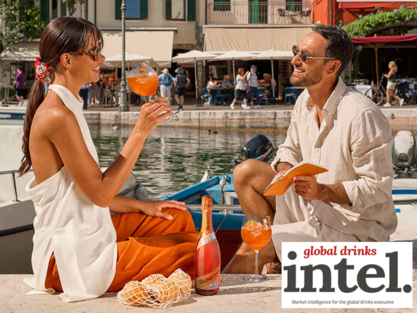 Two drinkers outside by a river with a bottle of Mionetto RTS