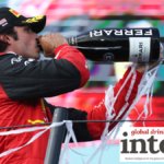 F1 driver Carlos Sainz with a bottle of Ferrari Trento at the Miami Grand Prix in 2022