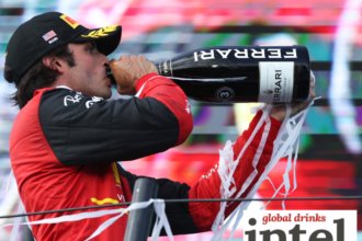 F1 driver Carlos Sainz with a bottle of Ferrari Trento at the Miami Grand Prix in 2022