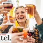 Younger drinkers toasting with glasses