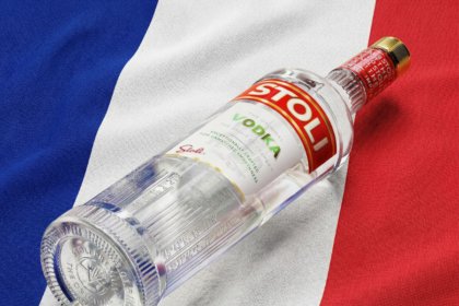 Stoli vodka bottle against French flag