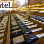 Row of champagne bottles on display in retail environment