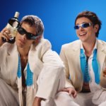 Ca7riel & Paco Amoroso with Ballantine's bottle and glass
