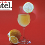 Glass of limoncello with lemon garnish