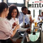 Patrons in a hotel bar enjoying drinks