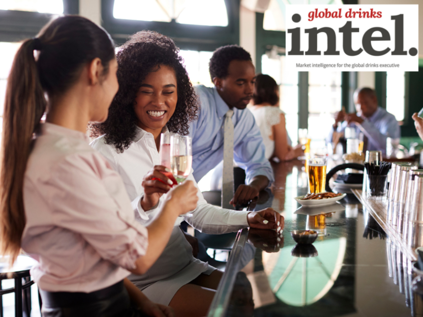 Patrons in a hotel bar enjoying drinks