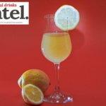Glass of limoncello with lemon garnish