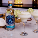 Bottle of Astral Tequila with two margarita serves