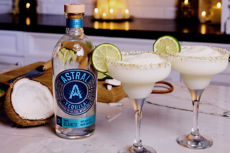 Bottle of Astral Tequila with two margarita serves