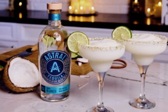 Bottle of Astral Tequila with two margarita serves