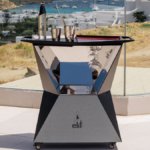 Elit-branded serving bar with Mykonos backdrop