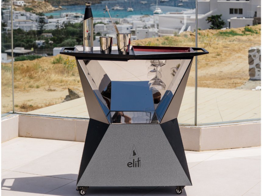 Elit-branded serving bar with Mykonos backdrop
