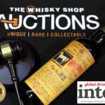 Bottle of White Horse whisky with hammer and gavel