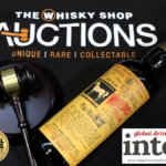 Bottle of White Horse whisky with hammer and gavel