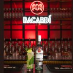 Bacardi bottle and serve on a bar