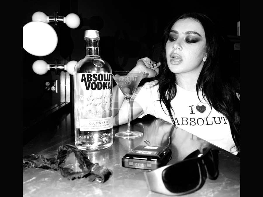 Charli xcx with bottle of Absolut