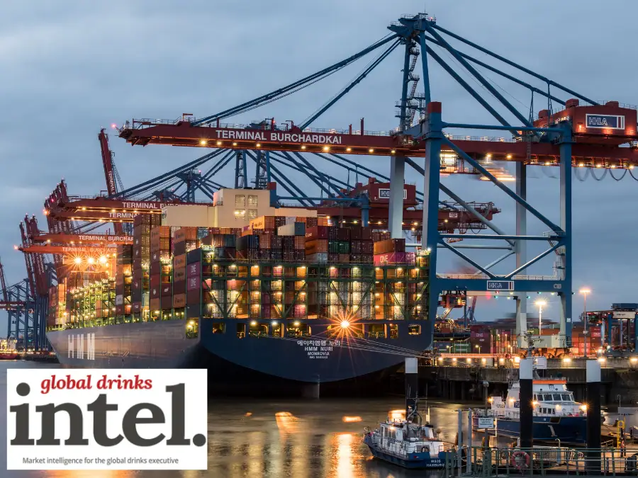 A ship in a port being loaded with containers