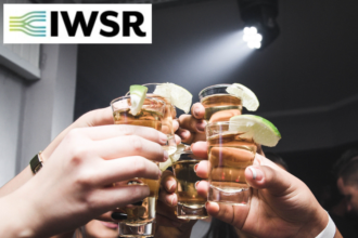 Tequila shots raised in a toast