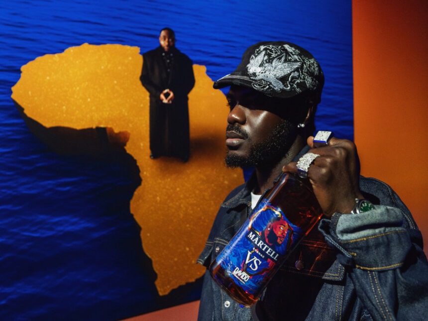 Prince Gyasi with Martell bottle