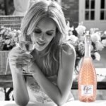 Kylie Minogue with bottle of Kylie wIne