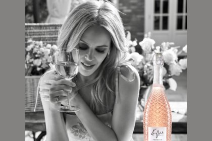 Kylie Minogue with bottle of Kylie wIne