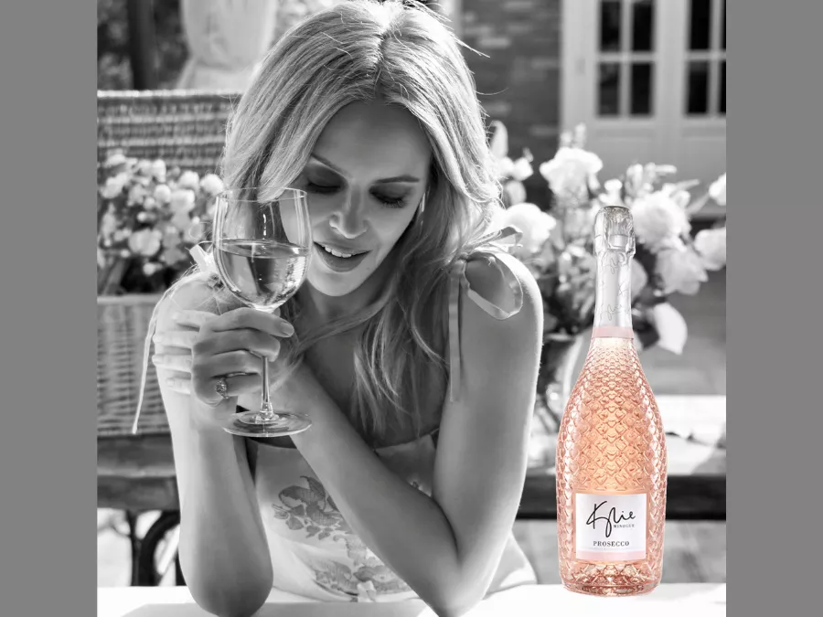 Kylie Minogue with bottle of Kylie wIne