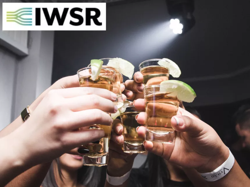 Tequila shots raised in a toast