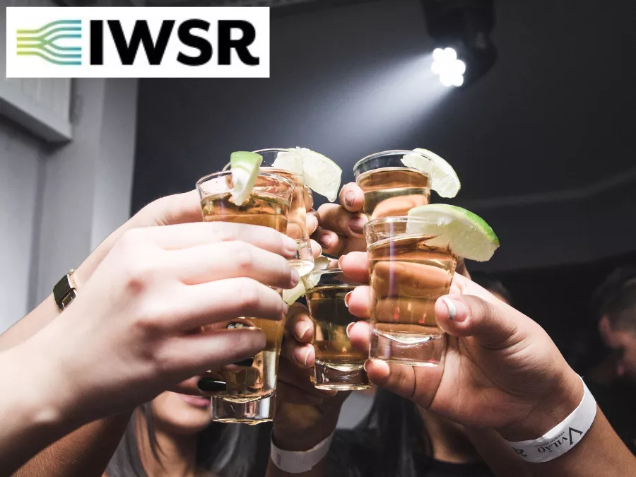 Tequila shots raised in a toast
